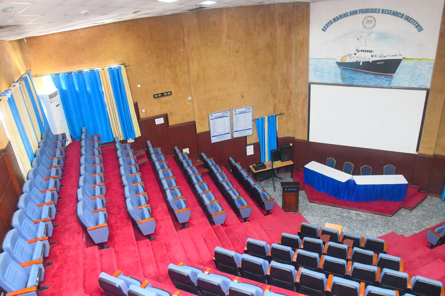 Main Auditorium - tiered seating and KMFRI branding