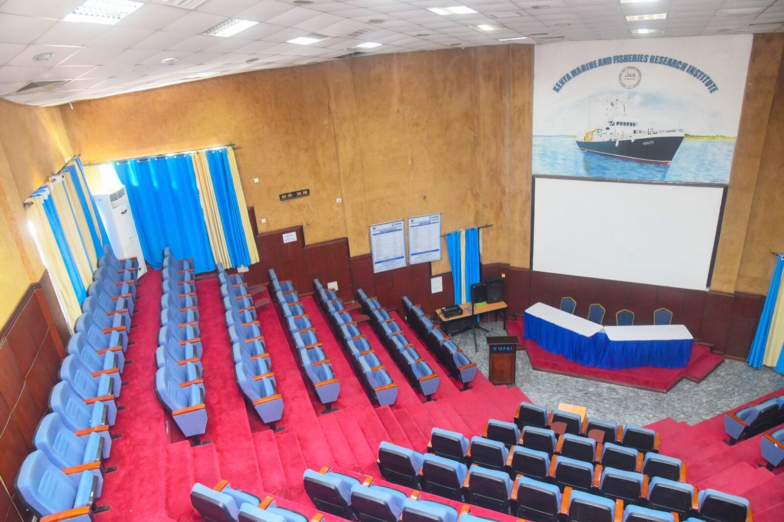 Main Auditorium interior showing the head table and tiered seating